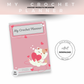 Crochet planner with a cat illustration on a pink background